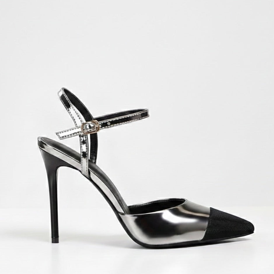 Black and silver high-heeled shoe on a white background