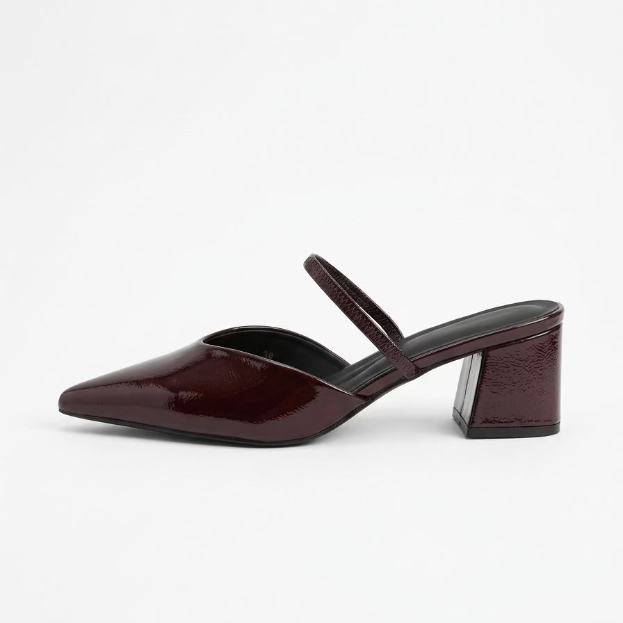 Brown high-heeled shoe on a white background facing left