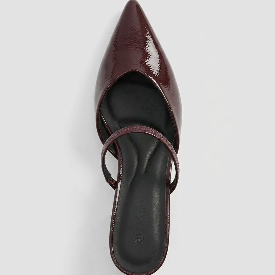 Maroon pointed-toe mule shoe on a white background top view